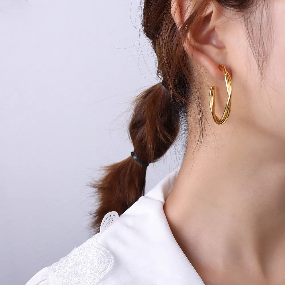 Golden Twist Cross Earrings with Titanium Finish - Unique Genie Collection Piece