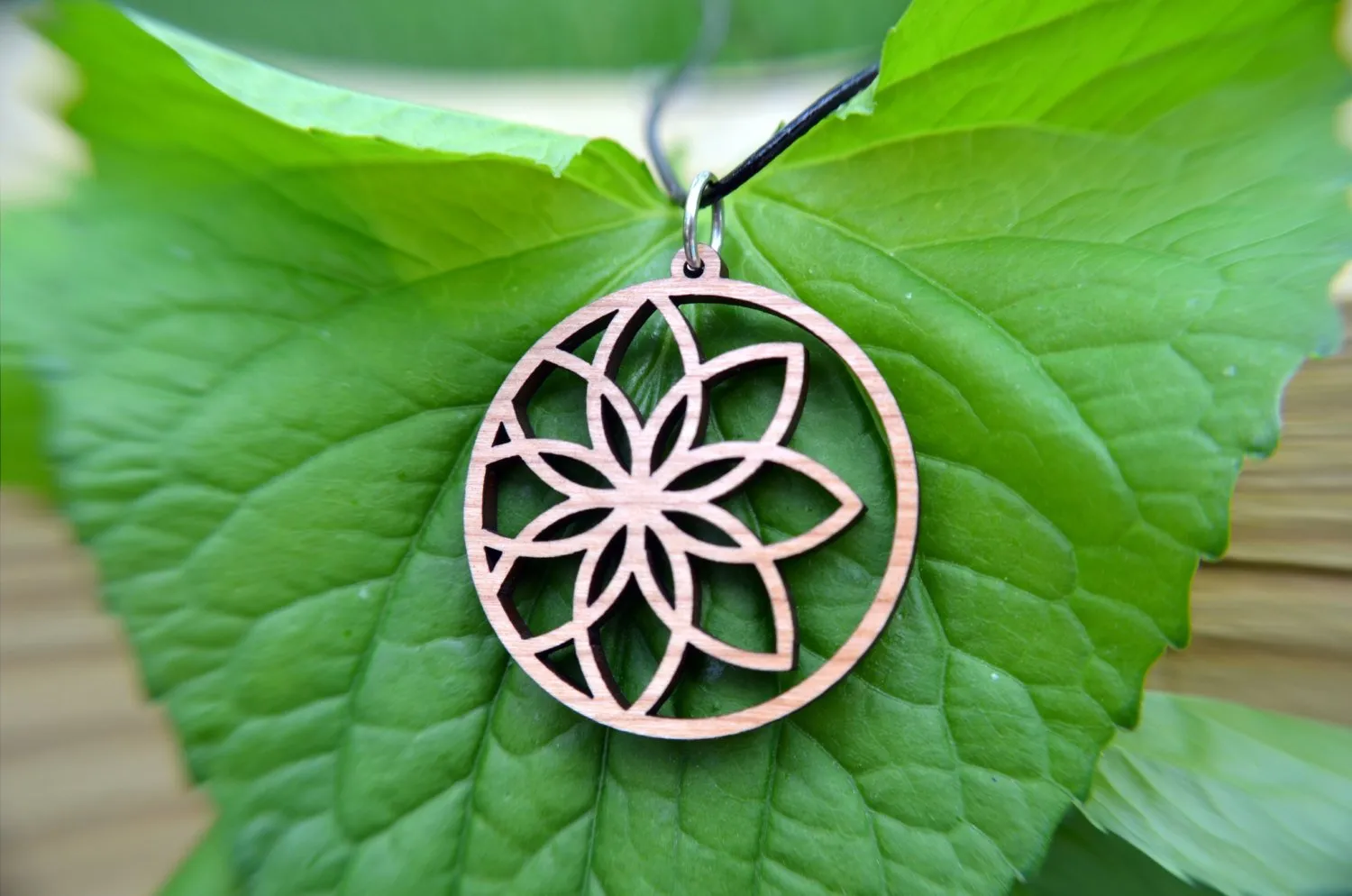 Lotus Flower Circle Pendant in cherry on leather cord